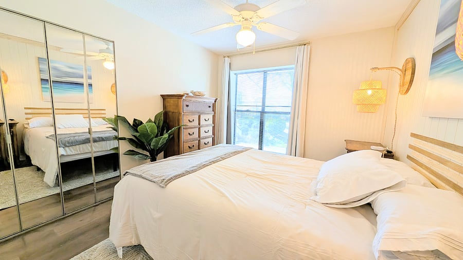 Spacious beachy-boho style master bedroom with full size mirror door closet, dresser, and comfy new queen-size memory foam mattress. This relaxing hideaway also has blackout curtains!