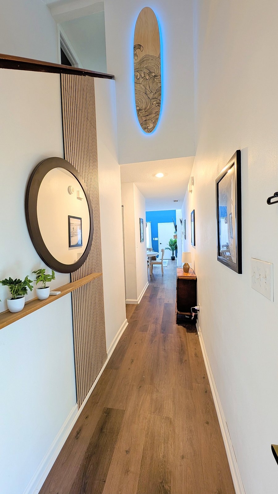 Retro-modern entry way with mirror, shelf for keys and sunglasses.