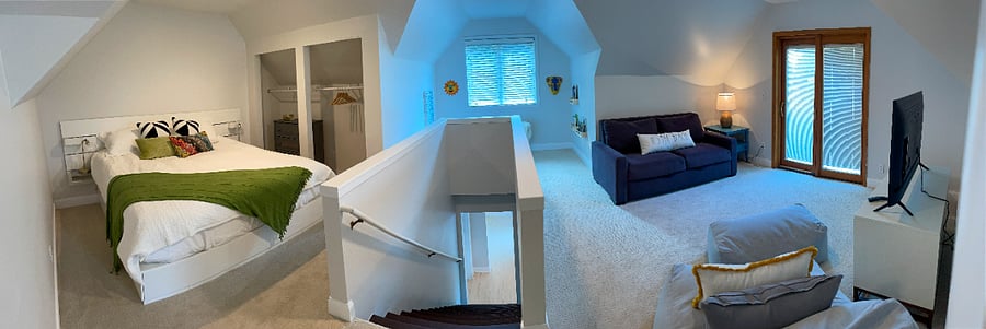 Panoramic view of 2nd floor - king bed, pull out cough with TV and small reading nook.