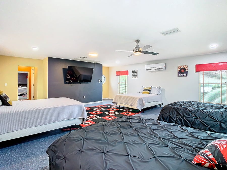 This is the Dorm Room over the garage.  4 queen beds and 2 trundels beds.  Private bath and smart TV.