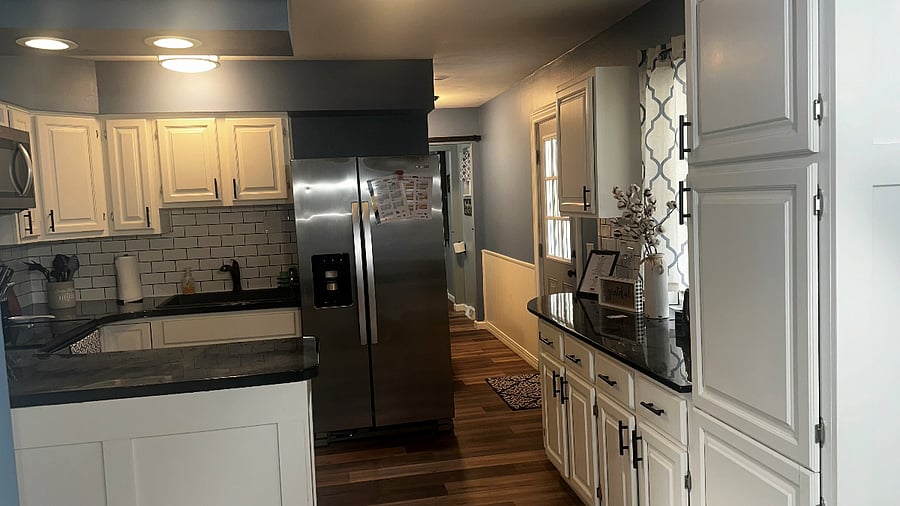 Kitchen facing the laundry room and half bath