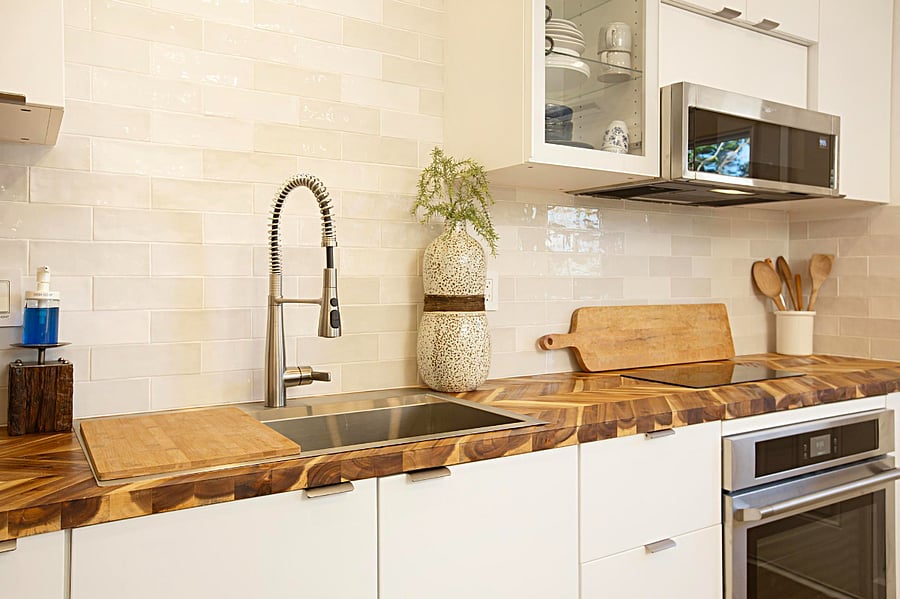 Full-size refrigerator, microwave, oven and extra large sink and two burner cooktop.