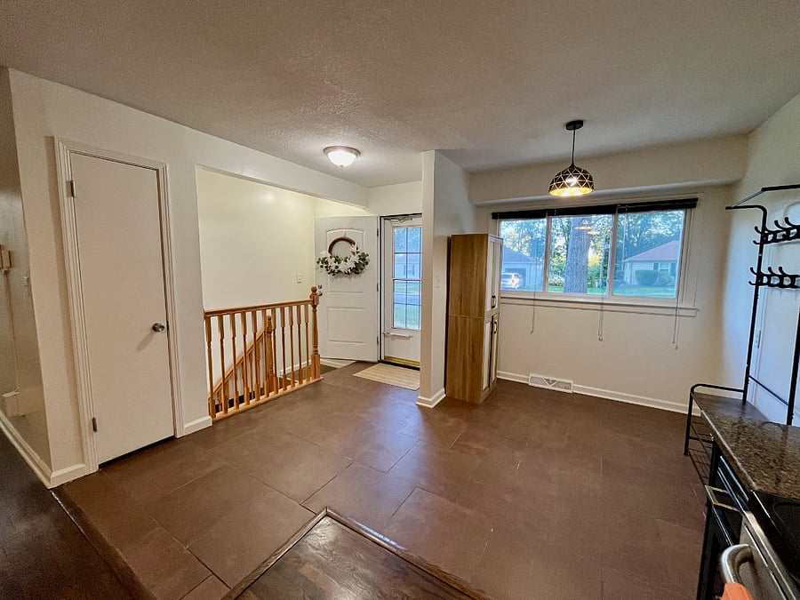 Entry way with coat rack and pantry.