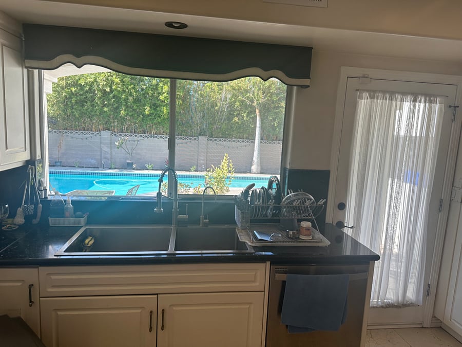 kitchen sink with view of the pool