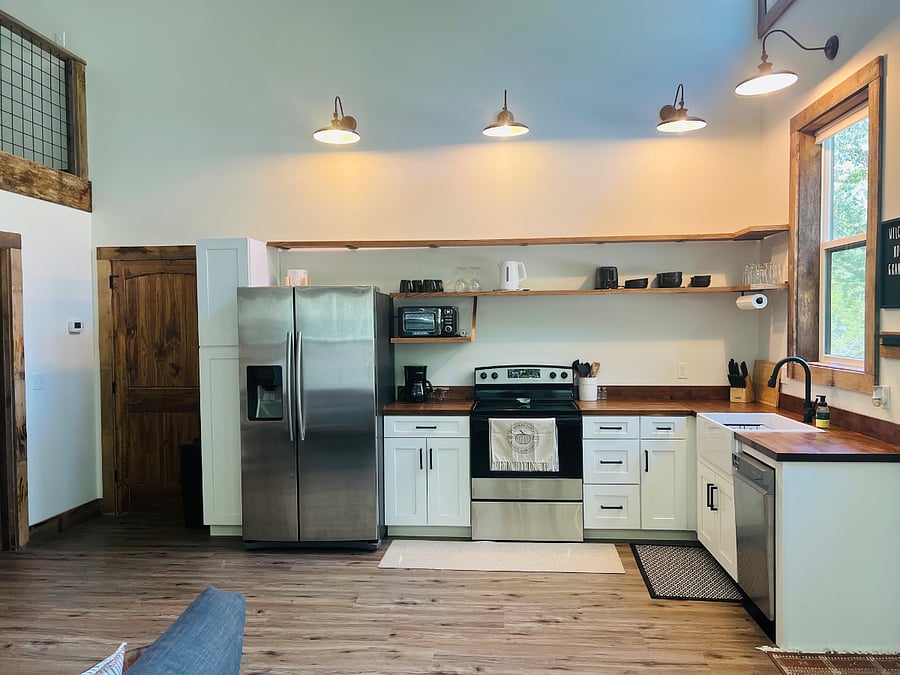Full sized well-equipped kitchen with full sized fridge, apartment size dishwasher, full size oven/stove. Cooking and baking essentials included. C