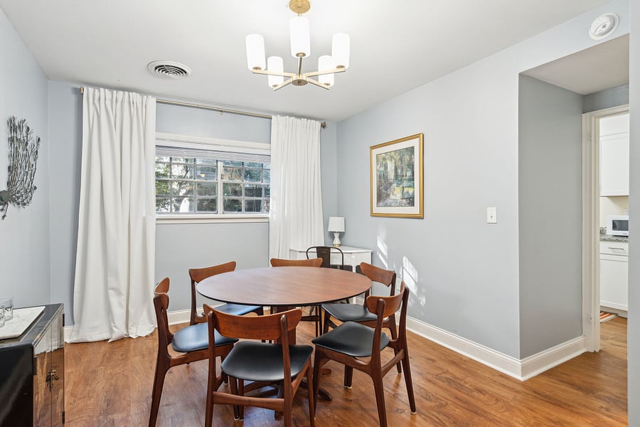 From the living room, you make your way into the dining area, which features a large 6-seater dining table. Perfect to enjoy your meals or to get some work done at. There is also a designated work-from-home desk in the corner if you'd prefer!