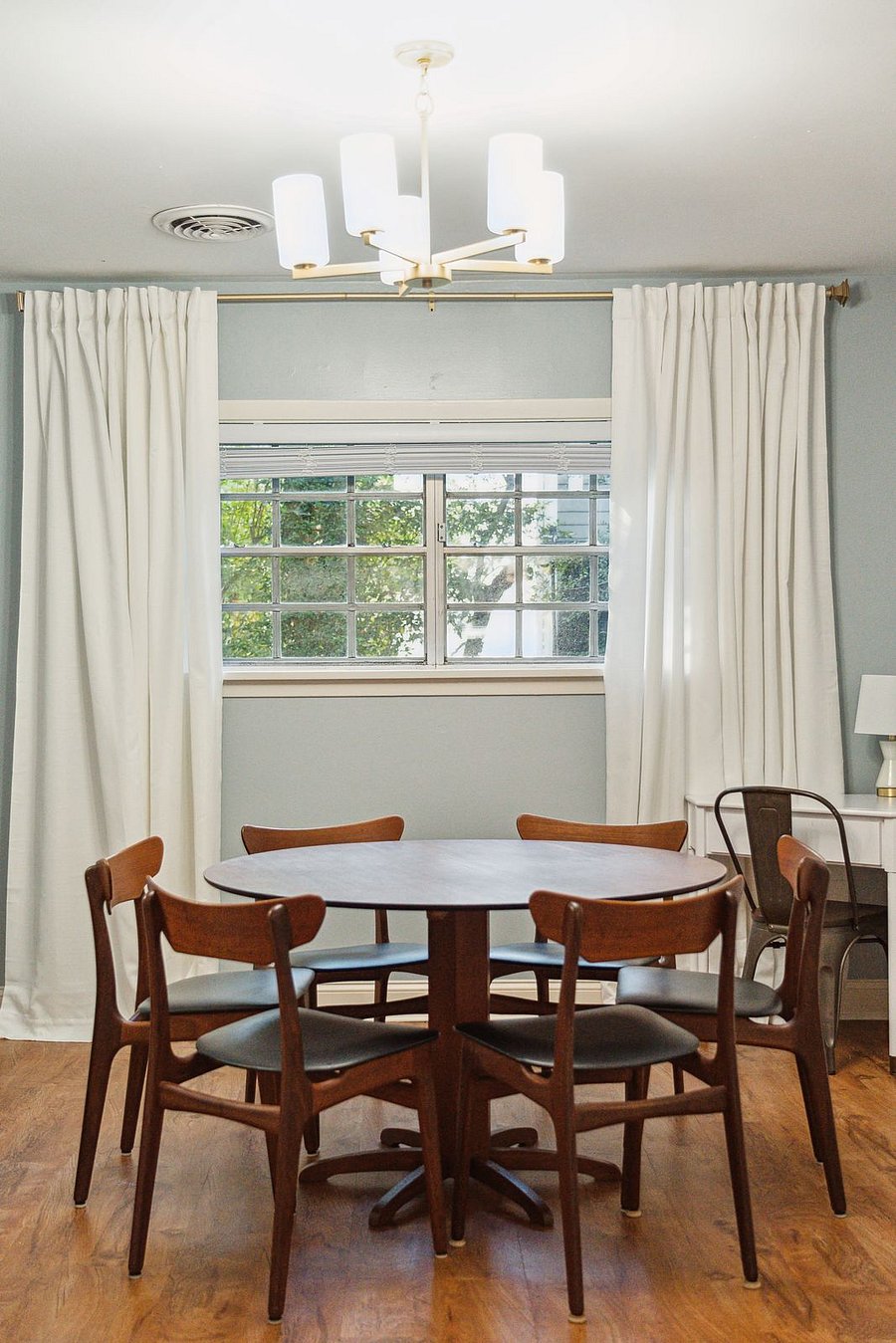 From the living room, you make your way into the dining area, which features a large 6-seater dining table. Perfect to enjoy your meals or to get some work done at. There is also a designated work-from-home desk in the corner if you'd prefer!