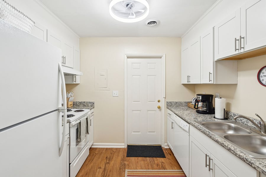 Off of the dining area is the galley-style kitchen. Fully equipped with all updated appliances and necessary culinary tools! We also provide a drip coffee maker with coffee, cream, and sugar.