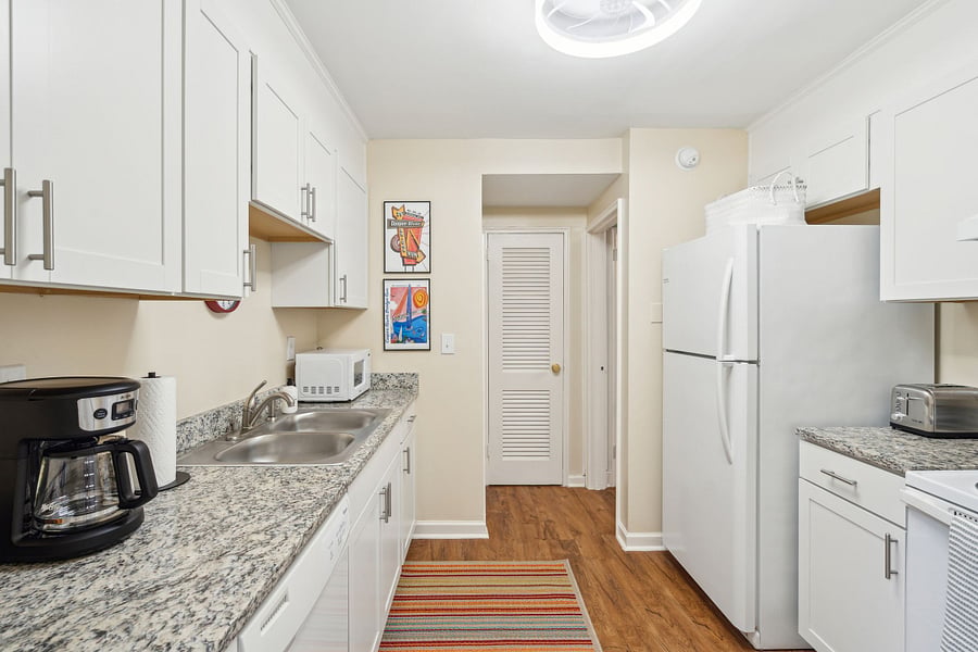 Off of the dining area is the galley-style kitchen. Fully equipped with all updated appliances and necessary culinary tools! We also provide a drip coffee maker with coffee, cream, and sugar.