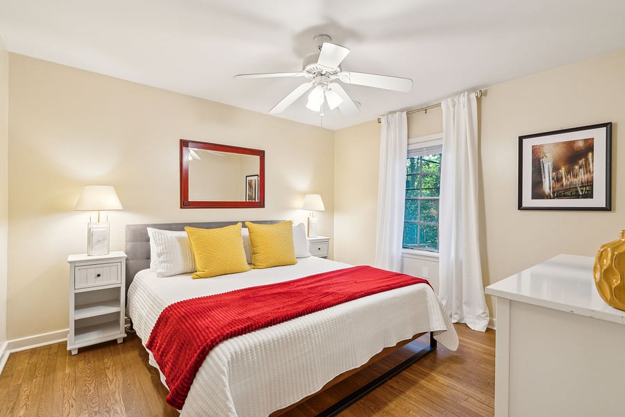 Bedroom #1 features a large and comfy king sized bed, dresser, closet, and Roku smart TV.