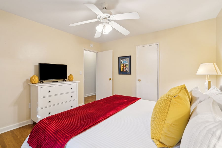 Bedroom #1 features a large and comfy king sized bed, dresser, closet, and Roku smart TV.