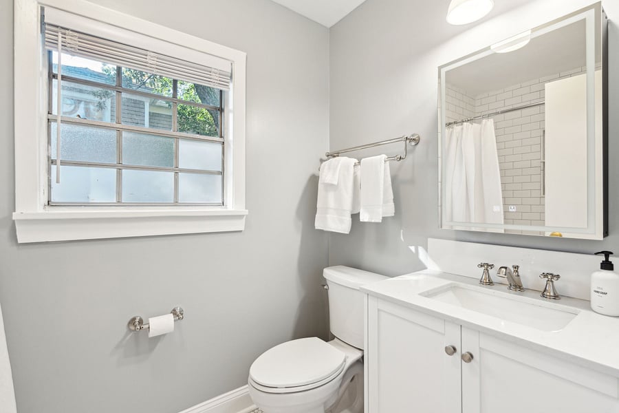 Bathroom #2 is located on the second floor and is also newly renovated. It includes a shower/tub combo with tiled walls and floors.