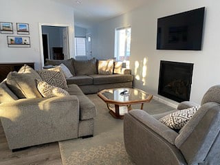 Open concept living area with vaulted ceiling.