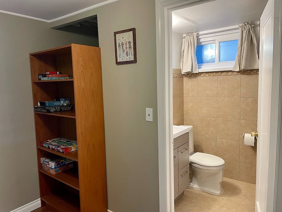 Hallway ends at bathroom
