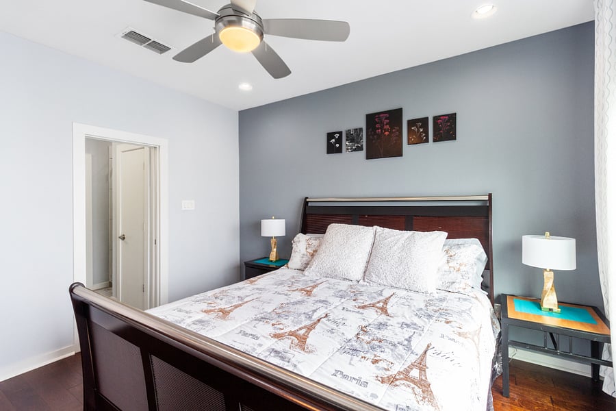 Sink into a plush king bed after a day of exploring. This beautifully styled, comfortable bedroom also features a full dresser, smart TV, ceiling fan, and an attached bathroom for maximum privacy.