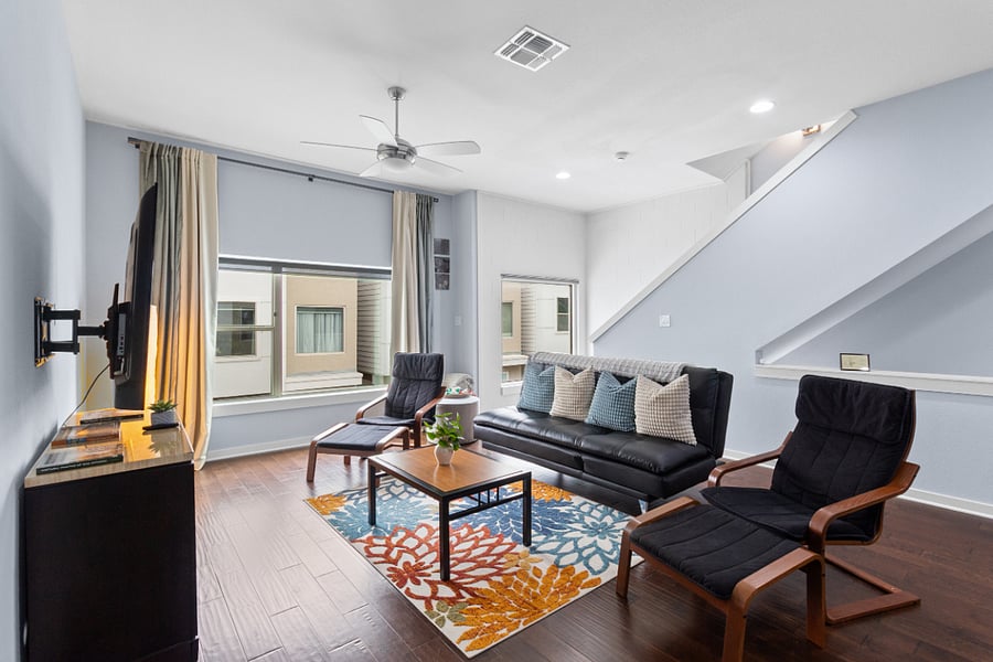 Kick back on the sleek leather sofa or unwind in one of the cozy accent chairs. With expansive windows, a mounted smart TV, and stylish modern finishes, its the perfect spot to stream your favorite shows after a day out.