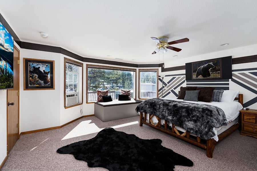 Master bedroom Bear theme! Be greeted by natural light with a stunning views of the mountain , ski lifts , and casinos all from your King Bed!