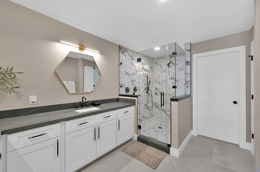 Two showerheads, two closet, two sinks.... this primary bathroom has it all.