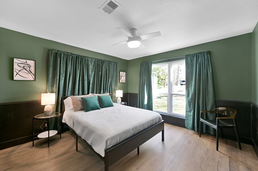 This bedroom has some serious black out curtains for late sleepers.