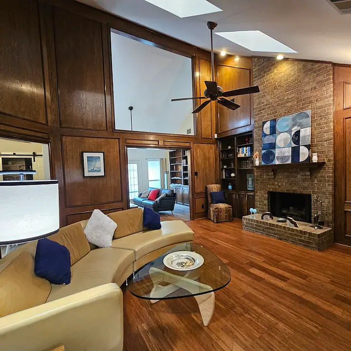 Front Living Room - An eclectic blend of MCM and contemporary furniture with classical art and modern decor in a relaxing neutral palette of blues, cream, and taupe.