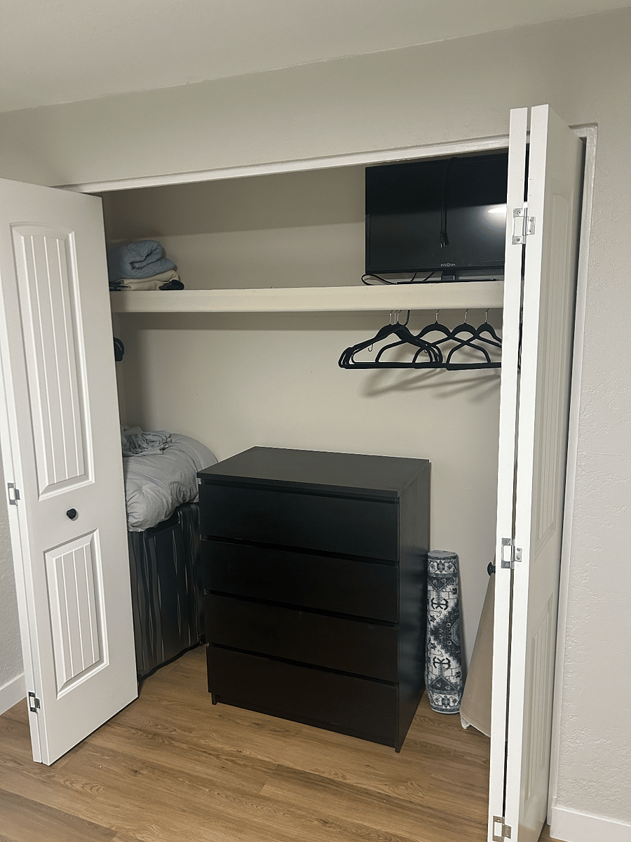 Large closet with dressing in spare bedroom