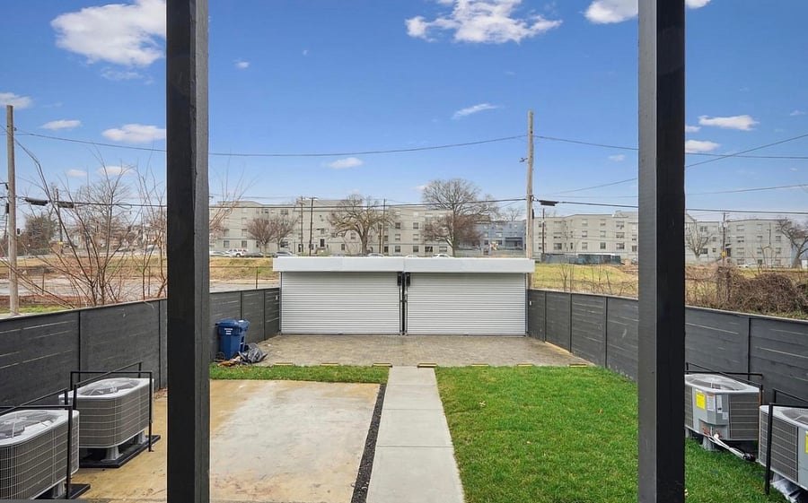 Backyard now has patio seating . This space is shared amongst the 5 other units in the building