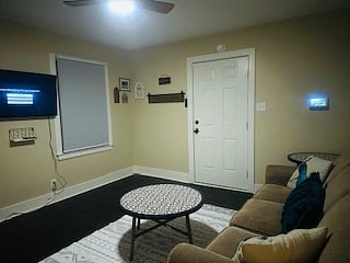 Security panel on right side of wall, monitored by ADT.