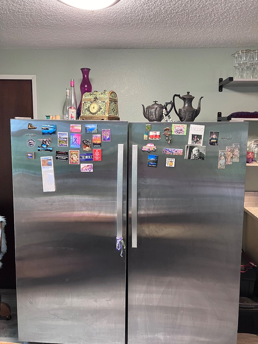 Large size refrigerator and freezer in kitchen.