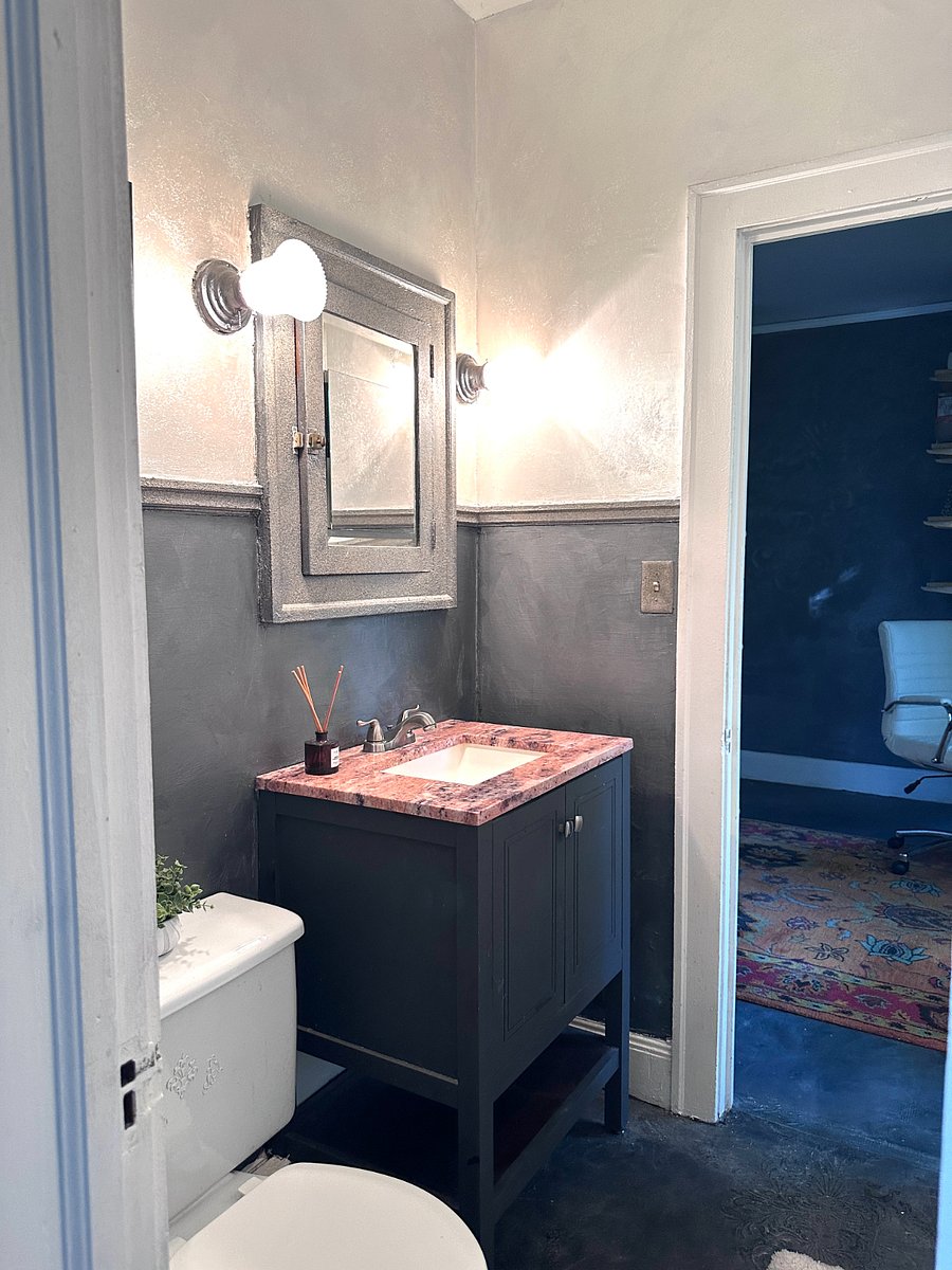 Bathroom with tub and shower. Located between bedrooms.