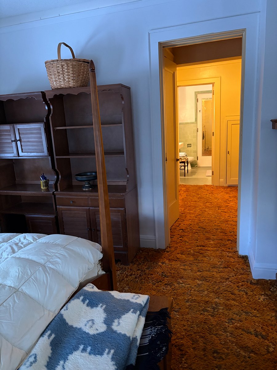 Hallway to bathroom with closet, dedicated shoe storage 