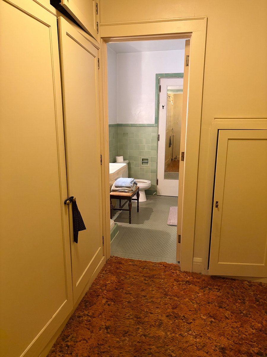 Bathroom with tub and handheld shower.