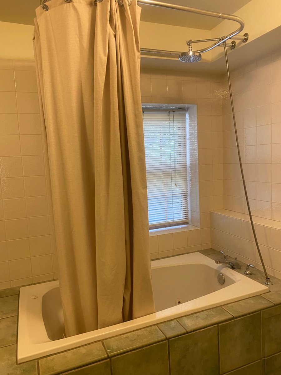 Rain shower and jetted tub. 