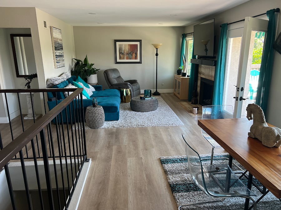 Living area with Big screen TV, Fireplace and large deck with views of La Jolla Skyline and sunsets