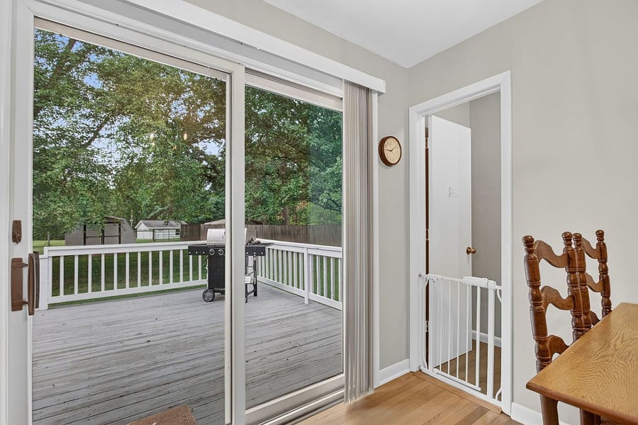Dedicated dining space for dinner, morning coffee, catching up on work or sharing the home with family or coworkers. Sliding glass door to back patio with grill and additional seating. 