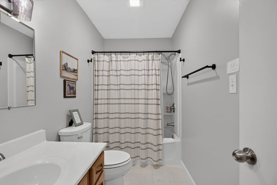 Main floor full bathroom with tub shower