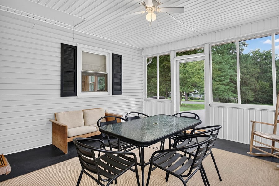 Large screened porch creates another comfortable living space for morning coffee, meals or relaxing after work.