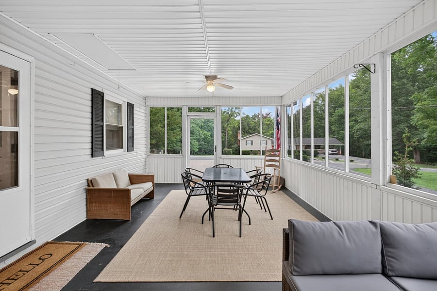 Enjoy outdoor living without the bugs  the screened porch has plenty of room for dining and unwinding