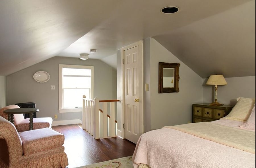 Sleeping loft with two twin beds, closet and mounted smart TV with streaming channels..