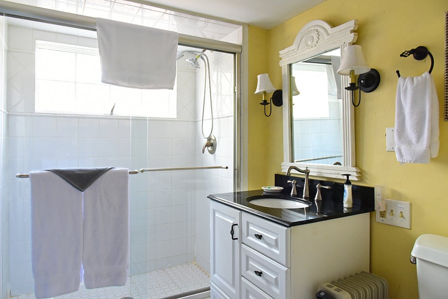 First floor bathroom with heater, shower and washer/dryer in closet.
