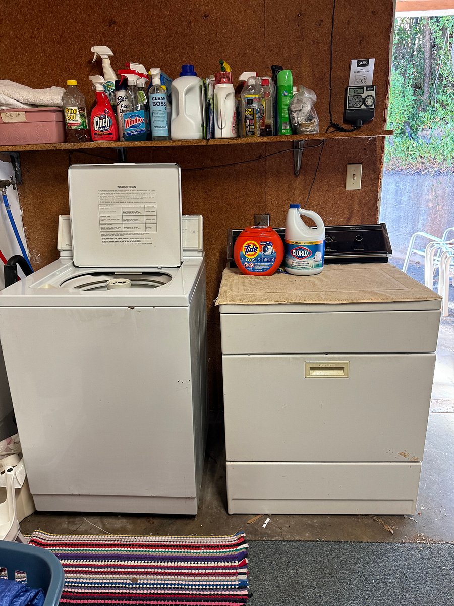 Washer and dryer in attached garage off the dining area.