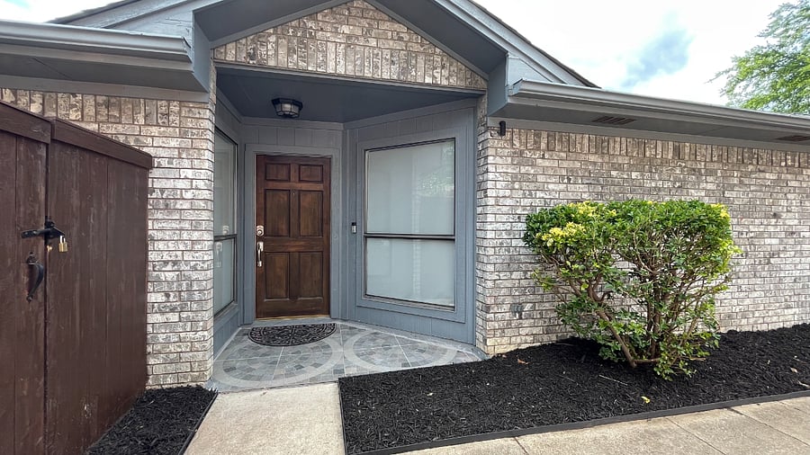 A private front entry is located on the left side of the home.