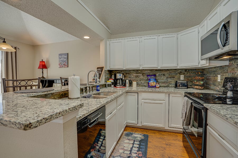 Our beautiful open concept kitchen has all new granite counters
