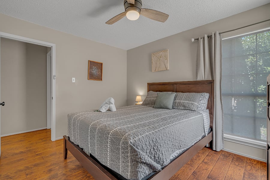 2nd guest bedroom has a queen bed, dresser and large closet