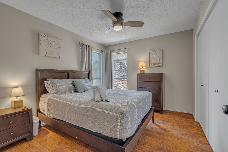 2nd guest bedroom has a queen bed, dresser and large closet