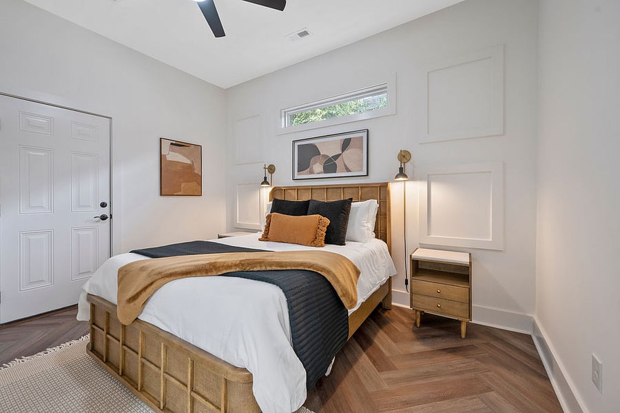 Step into our primary bedroom, where a cozy queen bed awaits, complemented by a sleek ensuite and a meticulously organized closet. Comfort and style combined for your perfect stay