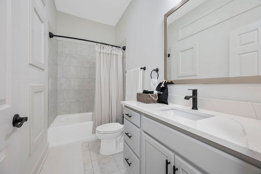 Enjoy the comfort of our second full bathroom, featuring a tub and shower combo. With its spa-inspired design, it's the ideal space for guests to unwind and relax.