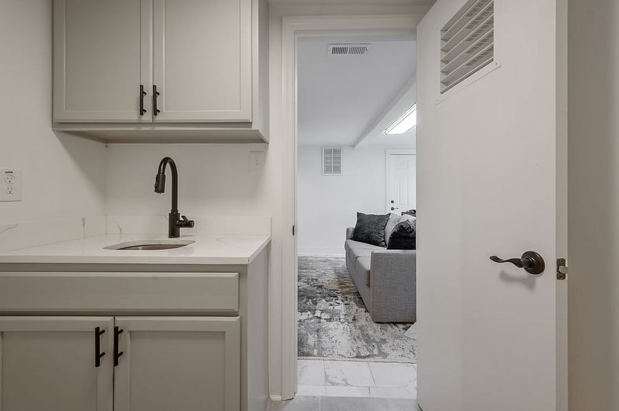 The attached kitchenette is perfect for enjoying drinks while watching a game, movie, or working in the lounge.