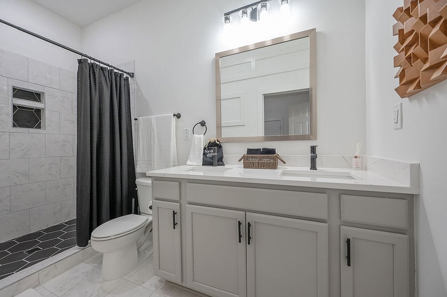 Experience the serenity of the primary ensuite bathroom, directly connected to the primary bedroom. It features an oversized walk-in shower for your ultimate relaxation.