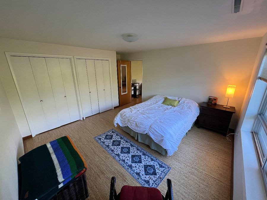 Your bedroom on east end of home opening to your private living room area with two windows giving lots of natural light, yet private with outdoor hedges separating from neighbors.