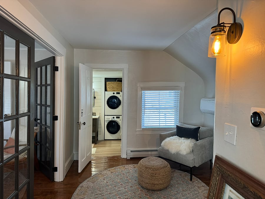 View to foyer from King Bedroom - Living area at left through French doors - luxury Bath straight ahead